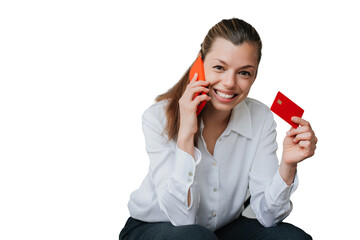Happy young woman in business attire talking by phone showing credit card  against transparent...