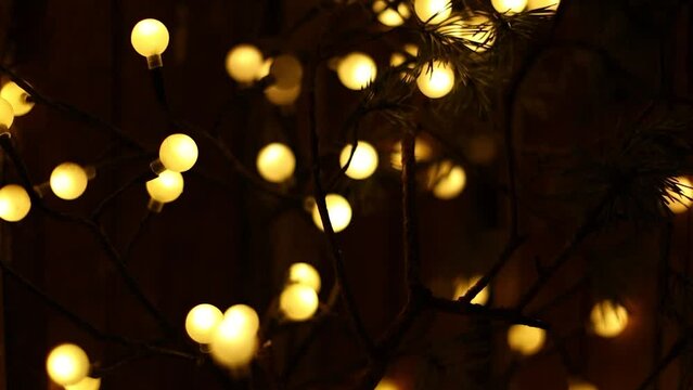 Yellow New Year's Eve lights in the evening. Garland for Christmas.