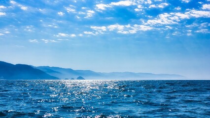 Puerto Vallarta, Mexico - February 06 2017 : the clear peaceful pacific ocean with puerto vallarta and his mountains