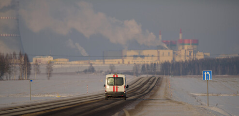 a reanimated car drives along the road towards the Belarusian nuclear power plant