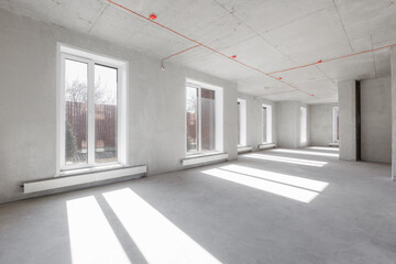 interior of the apartment without decoration in gray colors. rough finish