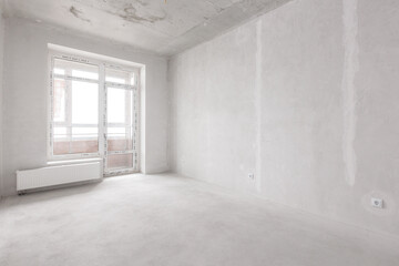 interior of the apartment without decoration in gray colors. rough finish