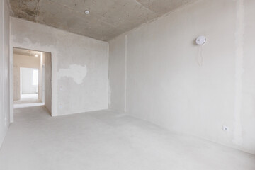 interior of the apartment without decoration in gray colors. rough finish