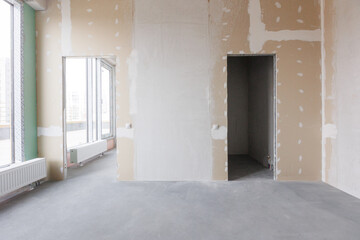 interior of the apartment without decoration in gray colors. rough finish
