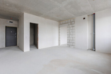 interior of the apartment without decoration in gray colors. rough finish