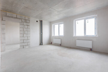 interior of the apartment without decoration in gray colors. rough finish