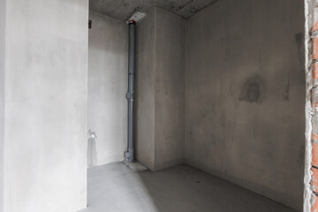 interior of the apartment without decoration in gray colors. rough finish