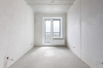 interior of the apartment without decoration in gray colors. rough finish