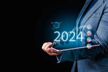 Navigate 2024 Investments Businessman's Tablet Displays Stock Analysis, Interest Rates, Operating...