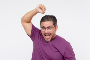 A middle aged man shows off his underarm, free from sweat and body odor. Deodorant advertisement concept. Isolated on a white background.