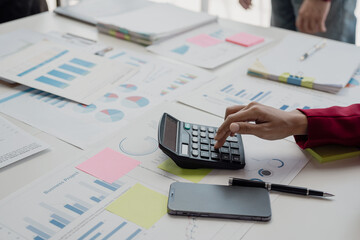 Tax reduction planning ideas Businessman calculating business balance preparing personal tax return...