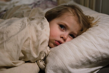 Child Falls Asleep. Peaceful Adorable Baby Sleeping at Home. Slumbering Little Toddler. Two Years Old Girl Sleeps. Nursery Room Interior Background. Serene Dream. Cute Face Close Up. Deep Kid Slumber
