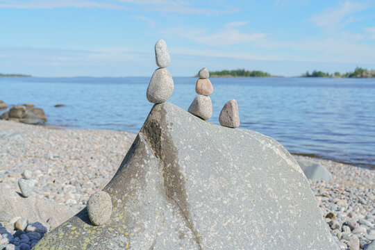 Stacked Rocks balancing, stacking with precision. Stone tower on the shore. Copy space