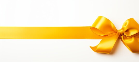 Golden ribbon bow with long straight ribbon for festive banner isolated on white background