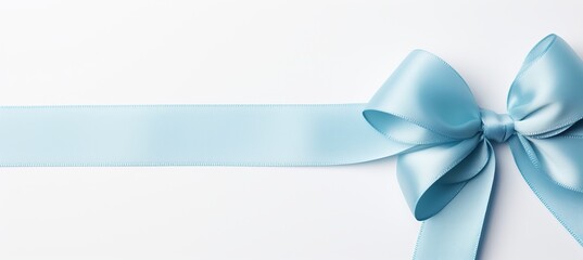Blue ribbon bow on white background with copy space, perfect for birthday or christmas banner