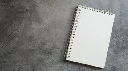 Blank notepad on gray desktop. Education, text, copy space concept 