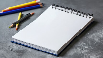 Blank notepad on gray desktop. Education, text, copy space concept 