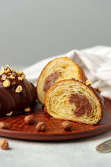 Glazed croissants on clay plate on table