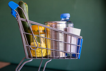 Shopping cart represents the costs of living holding house supplies