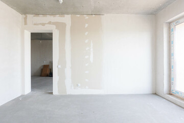 interior of the apartment without decoration in gray colors. rough finish