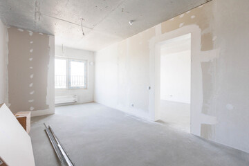 interior of the apartment without decoration in gray colors. rough finish