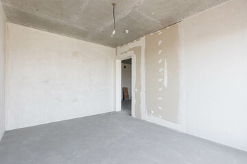 interior of the apartment without decoration in gray colors. rough finish