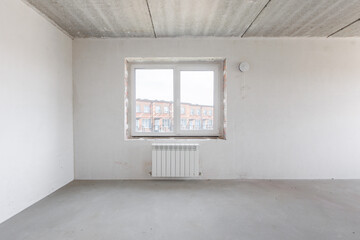 interior of the apartment without decoration in gray colors. rough finish