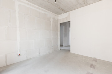 interior of the apartment without decoration in gray colors. rough finish