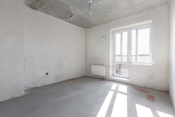 interior of the apartment without decoration in gray colors. rough finish