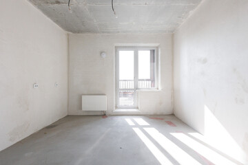 interior of the apartment without decoration in gray colors. rough finish