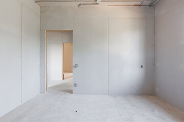 interior of the apartment without decoration in gray colors. rough finish