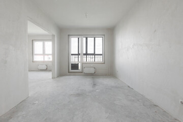 Fototapeta premium interior of the apartment without decoration in gray colors. rough finish