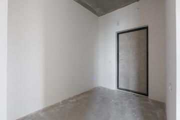 interior of the apartment without decoration in gray colors. rough finish