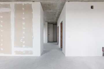 interior of the apartment without decoration in gray colors. rough finish