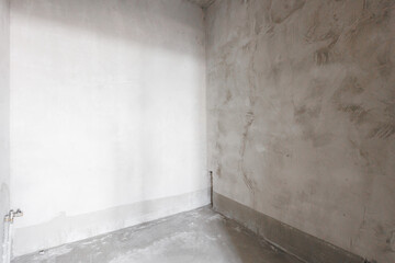 interior of the apartment without decoration in gray colors. rough finish