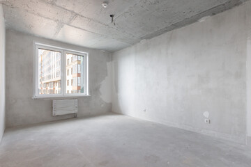 interior of the apartment without decoration in gray colors. rough finish