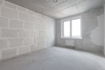 interior of the apartment without decoration in gray colors. rough finish