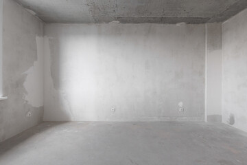 interior of the apartment without decoration in gray colors. rough finish