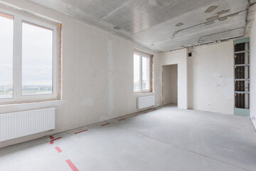 interior of the apartment without decoration in gray colors. rough finish