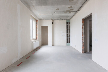 interior of the apartment without decoration in gray colors. rough finish