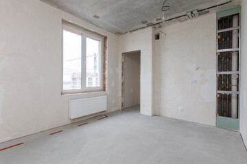 interior of the apartment without decoration in gray colors. rough finish