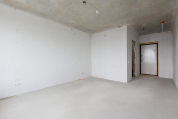 interior of the apartment without decoration in gray colors. rough finish