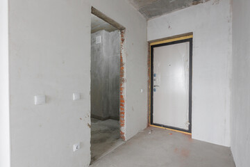 interior of the apartment without decoration in gray colors. rough finish