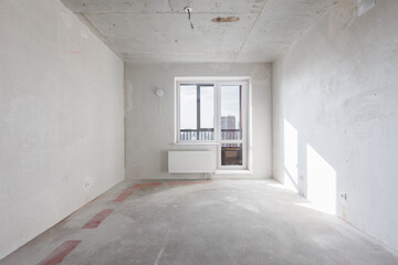 interior of the apartment without decoration in gray colors. rough finish