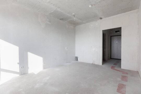 interior of the apartment without decoration in gray colors. rough finish