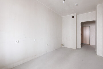 interior of the apartment without decoration in gray colors. rough finish