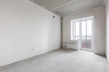 Fototapeta premium interior of the apartment without decoration in gray colors. rough finish