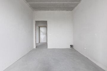 interior of the apartment without decoration in gray colors. rough finish