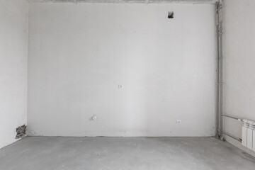 interior of the apartment without decoration in gray colors. rough finish