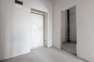 interior of the apartment without decoration in gray colors. rough finish